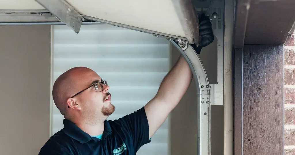 garage door spring measuring by a meadow expert technician