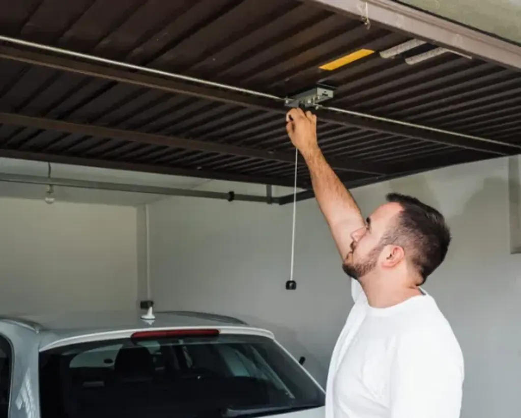 owner pulling garage door residential