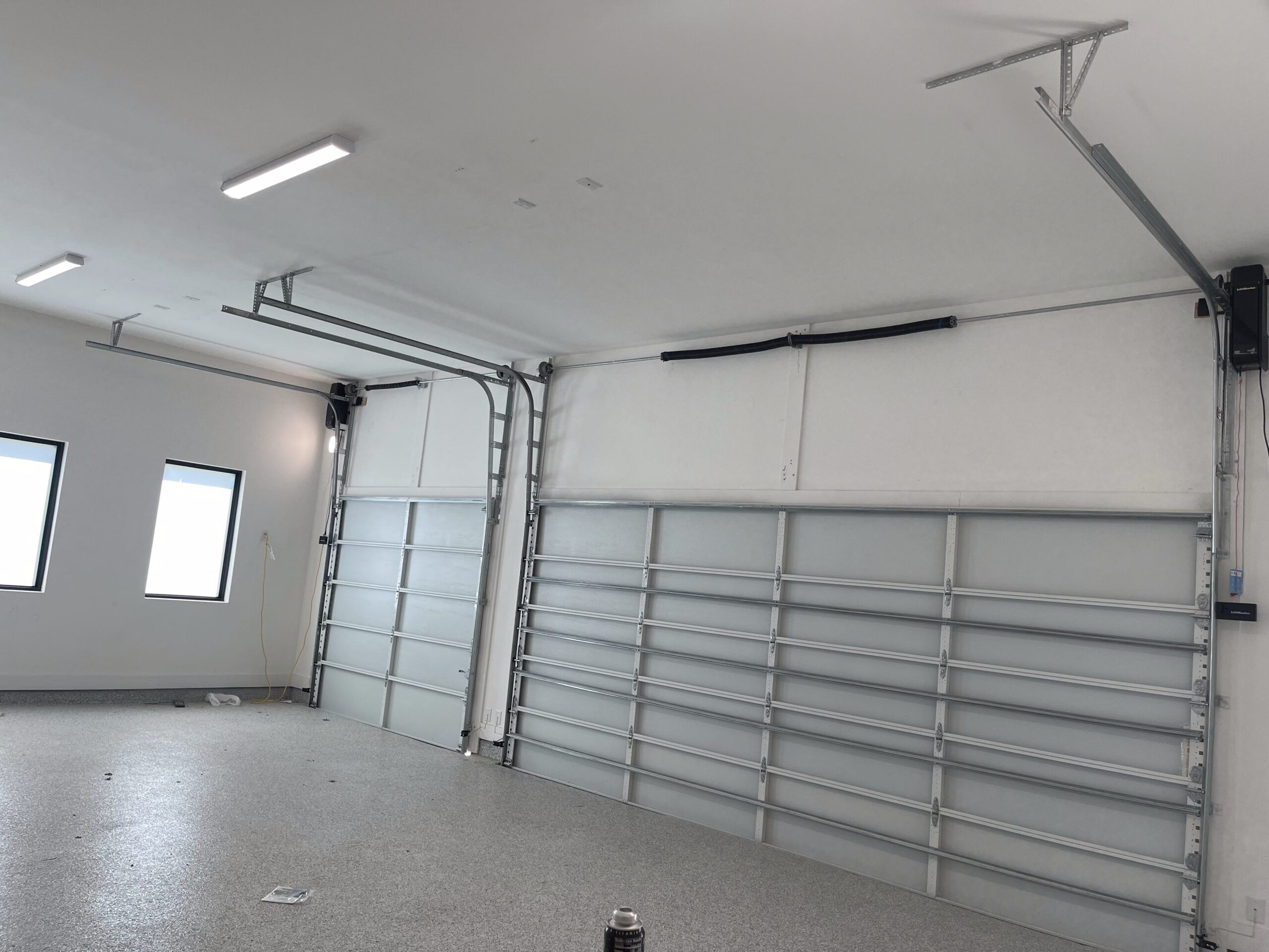 Interior high lift metal garage door