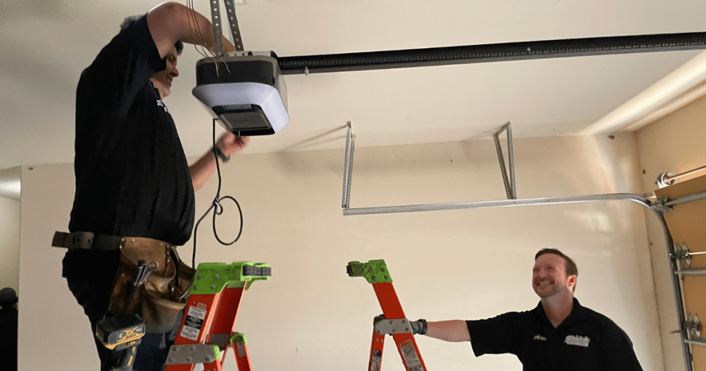 Two men installing garage opener