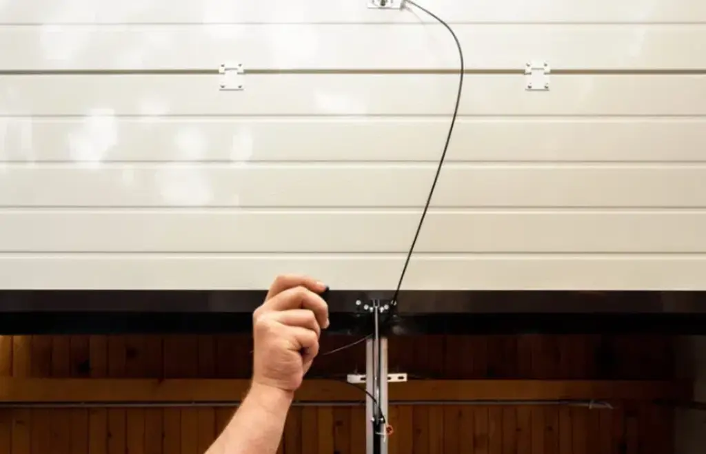 person pulling garage door