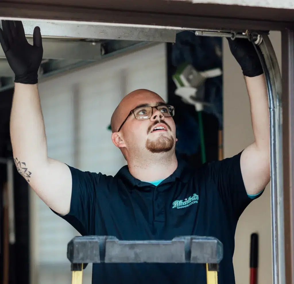 foreman repairing meadows garage doors