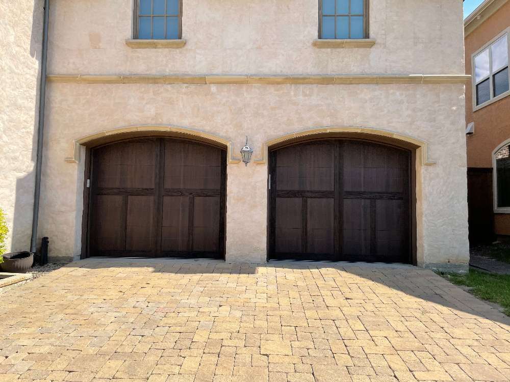 2 wooden single car garage doors