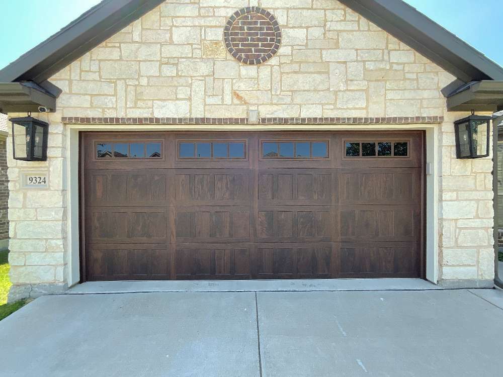 Brown wooden 2-car garage door with windows