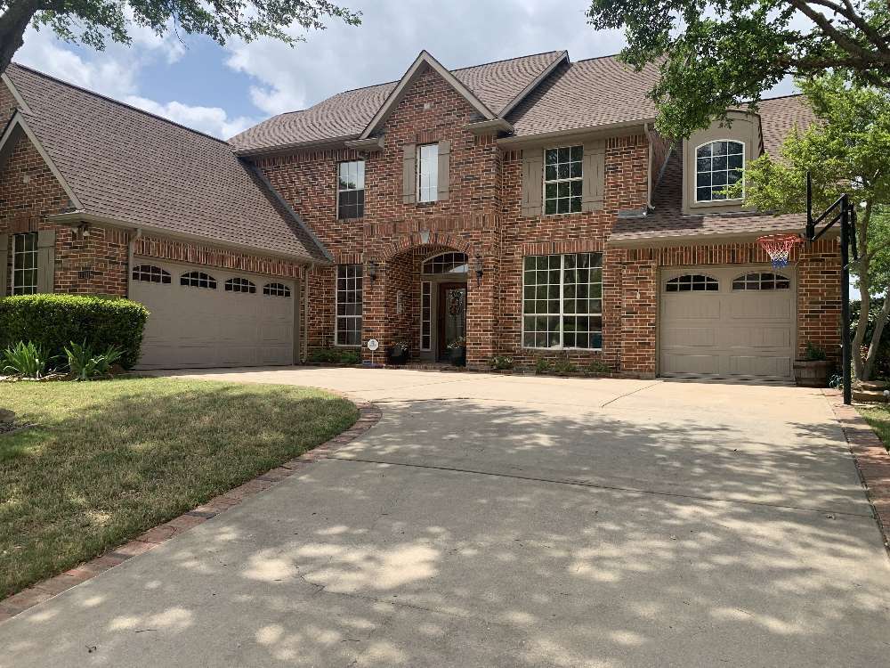 House with a 2-car and single car standard garage door