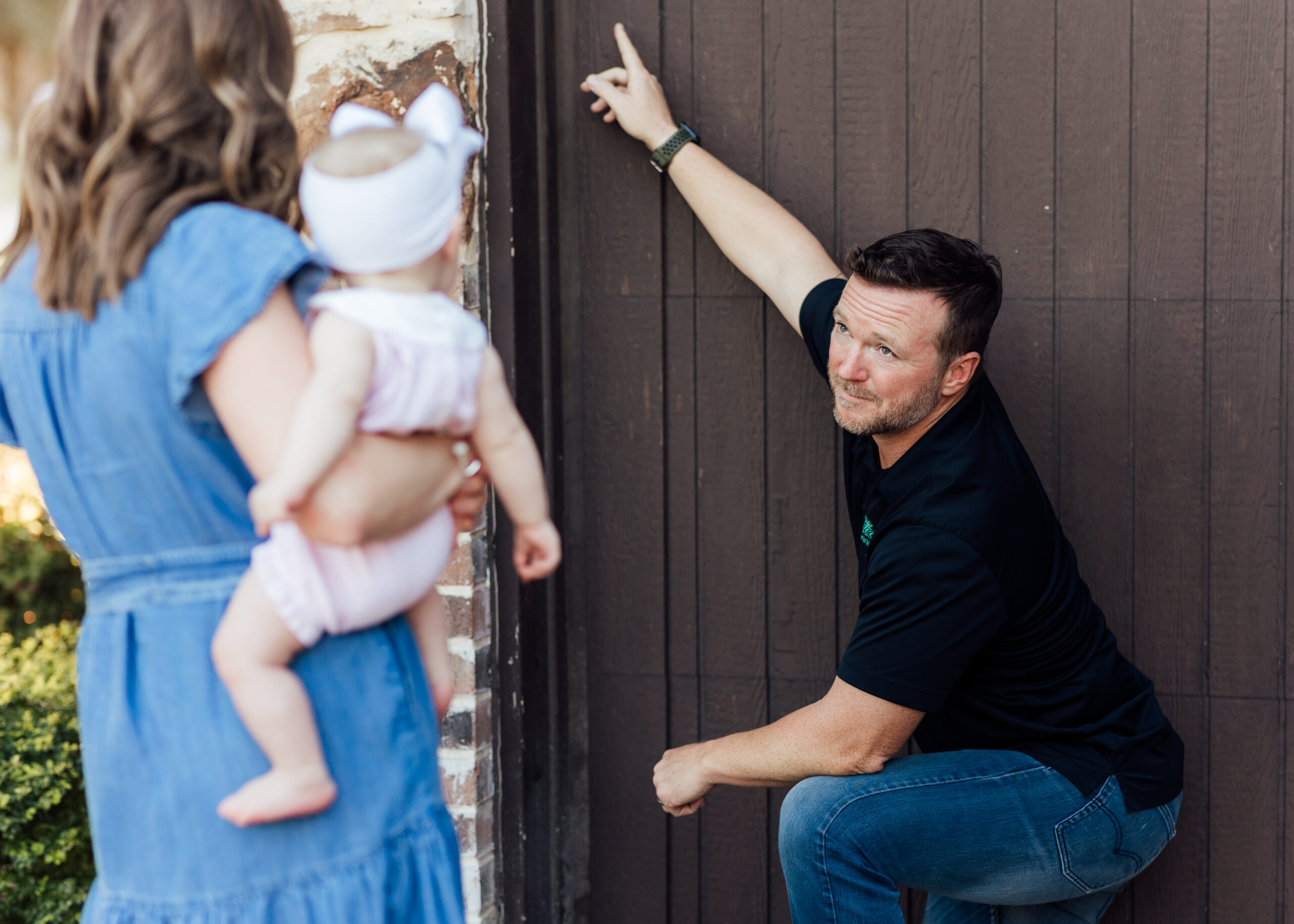 Team member explaining garage door opener to client