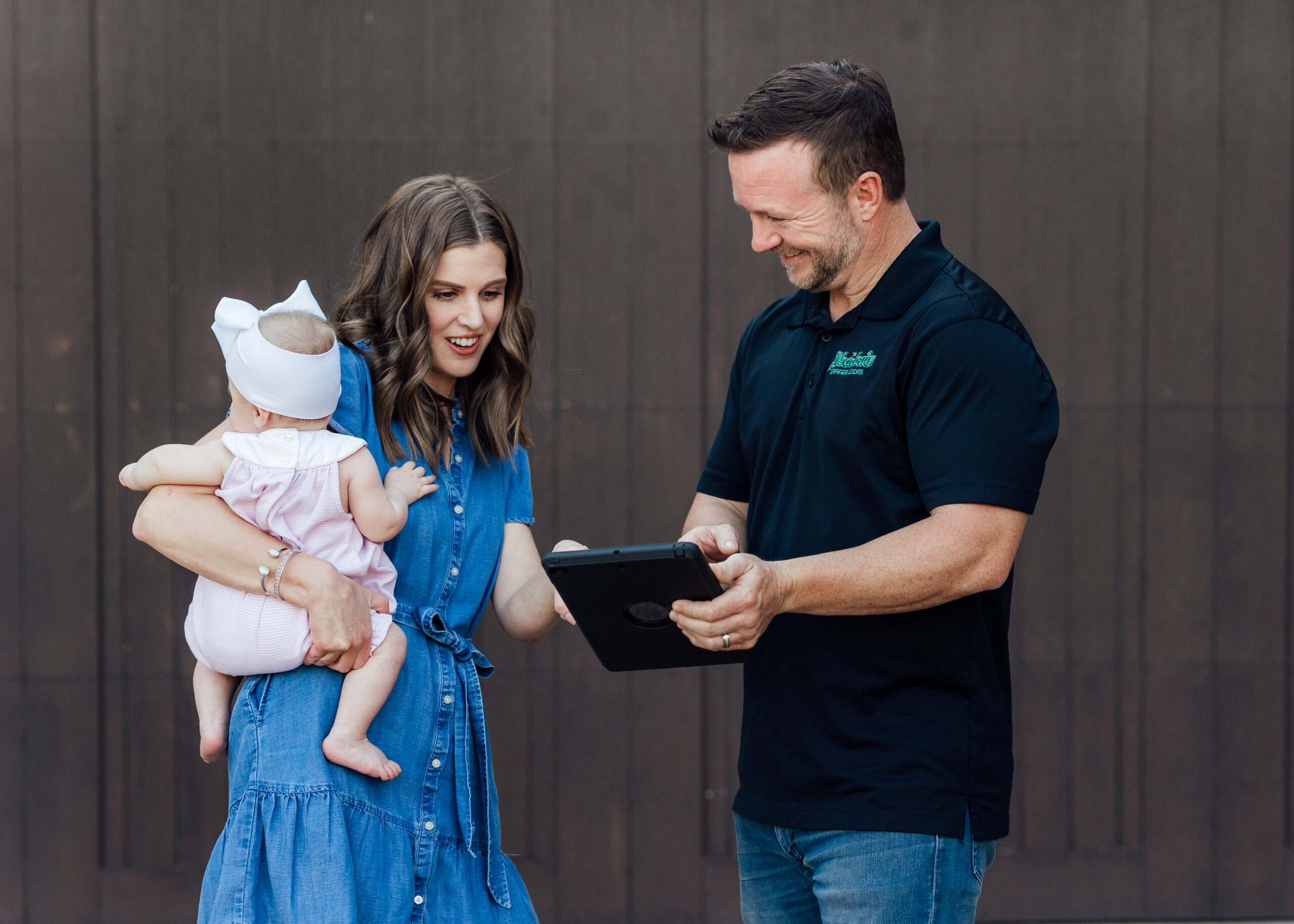 Aaron Meadows talking with home-owner and her baby