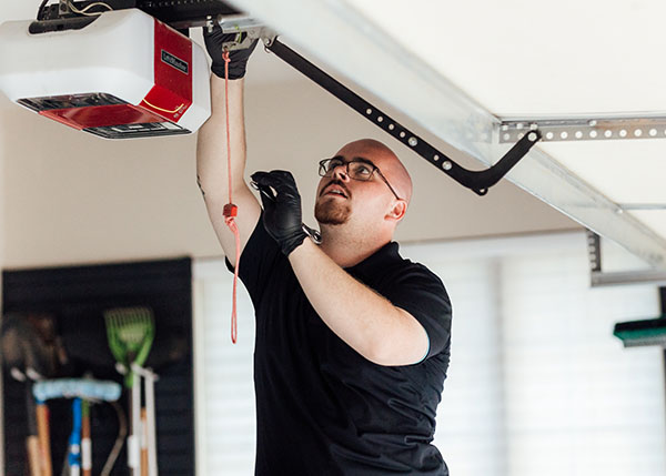 Team member working on garage door opener