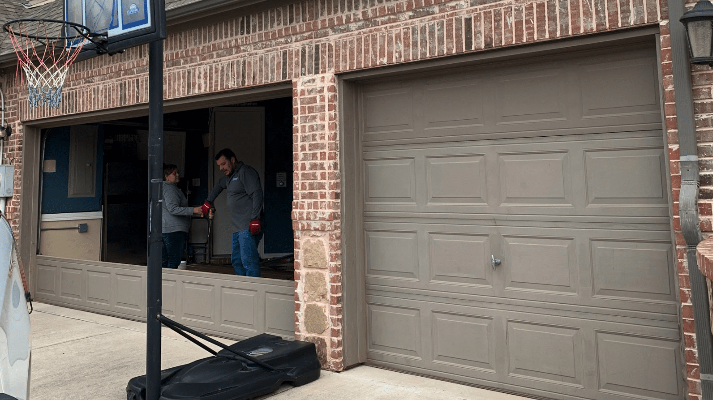 Grey residential garage door - faux wood garage door before