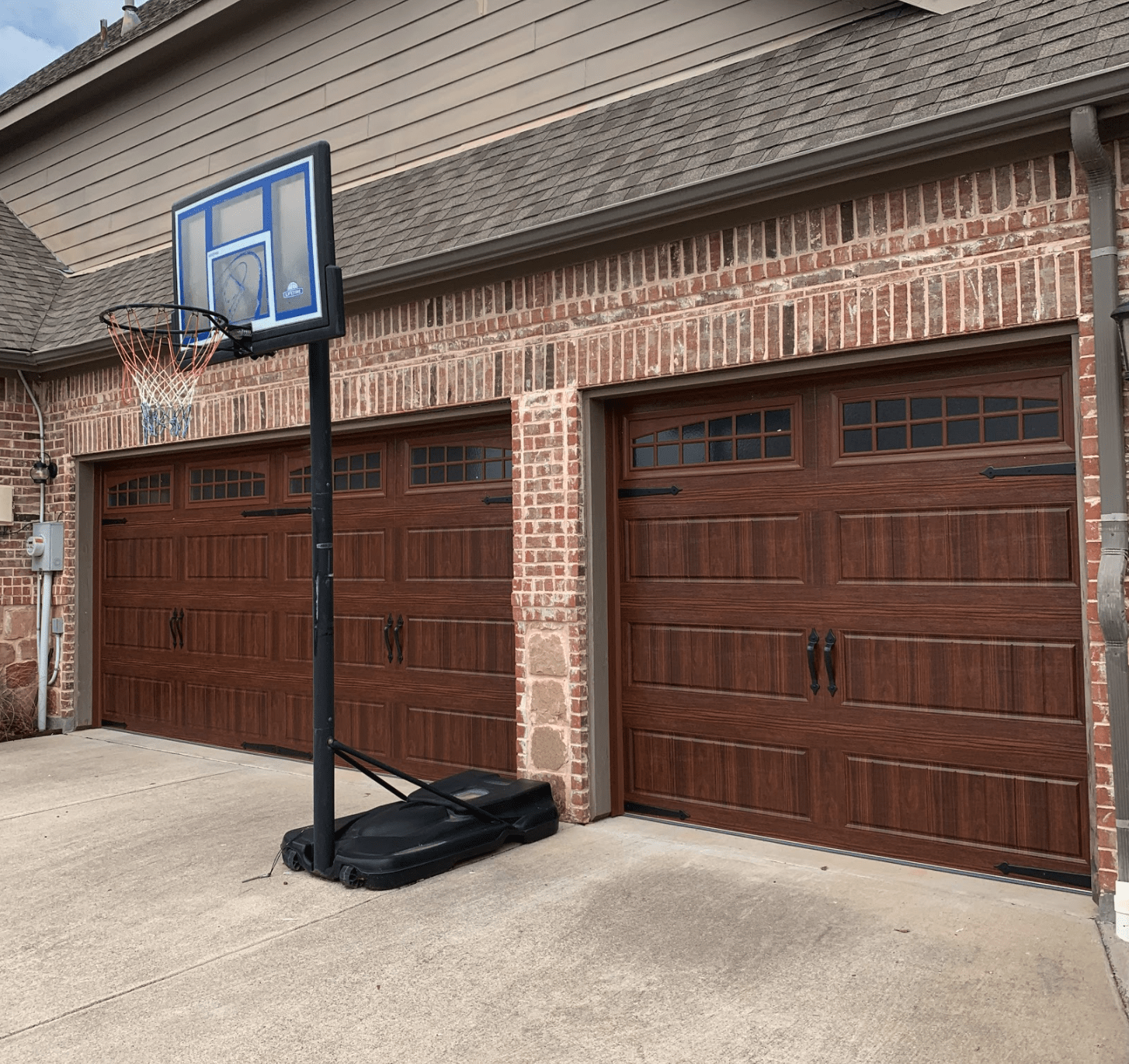 Faux wood residential garage door