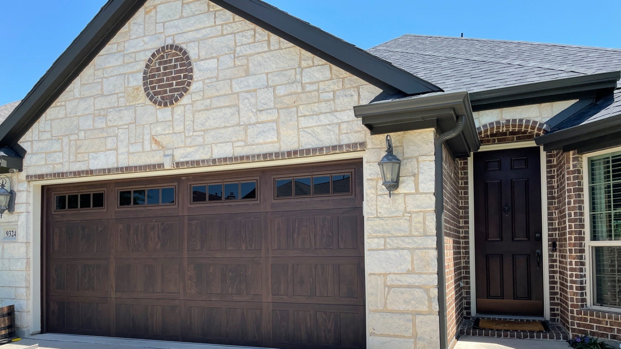 Walnut wood tone residential garage door