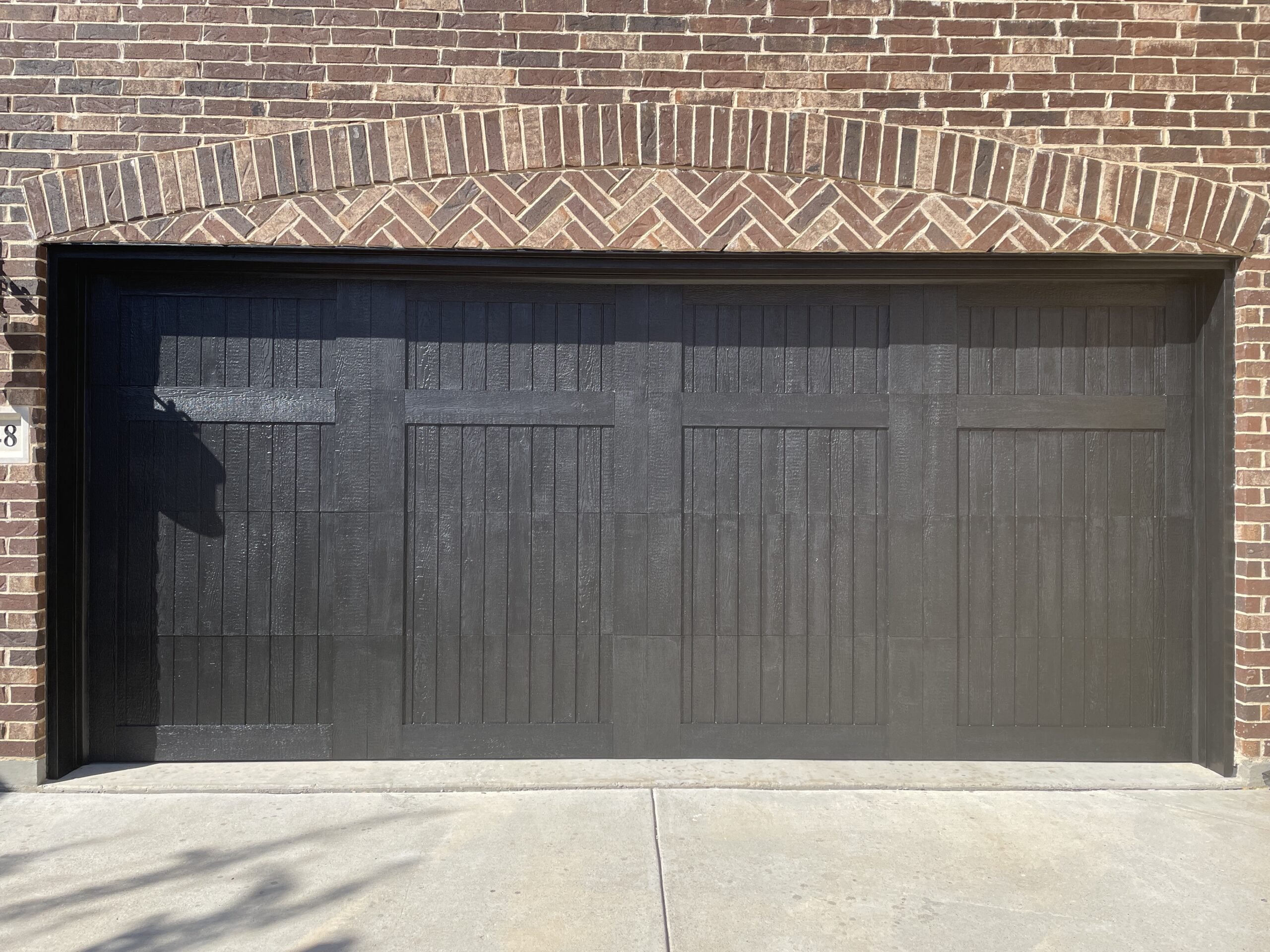 Residential black vinyl garage door