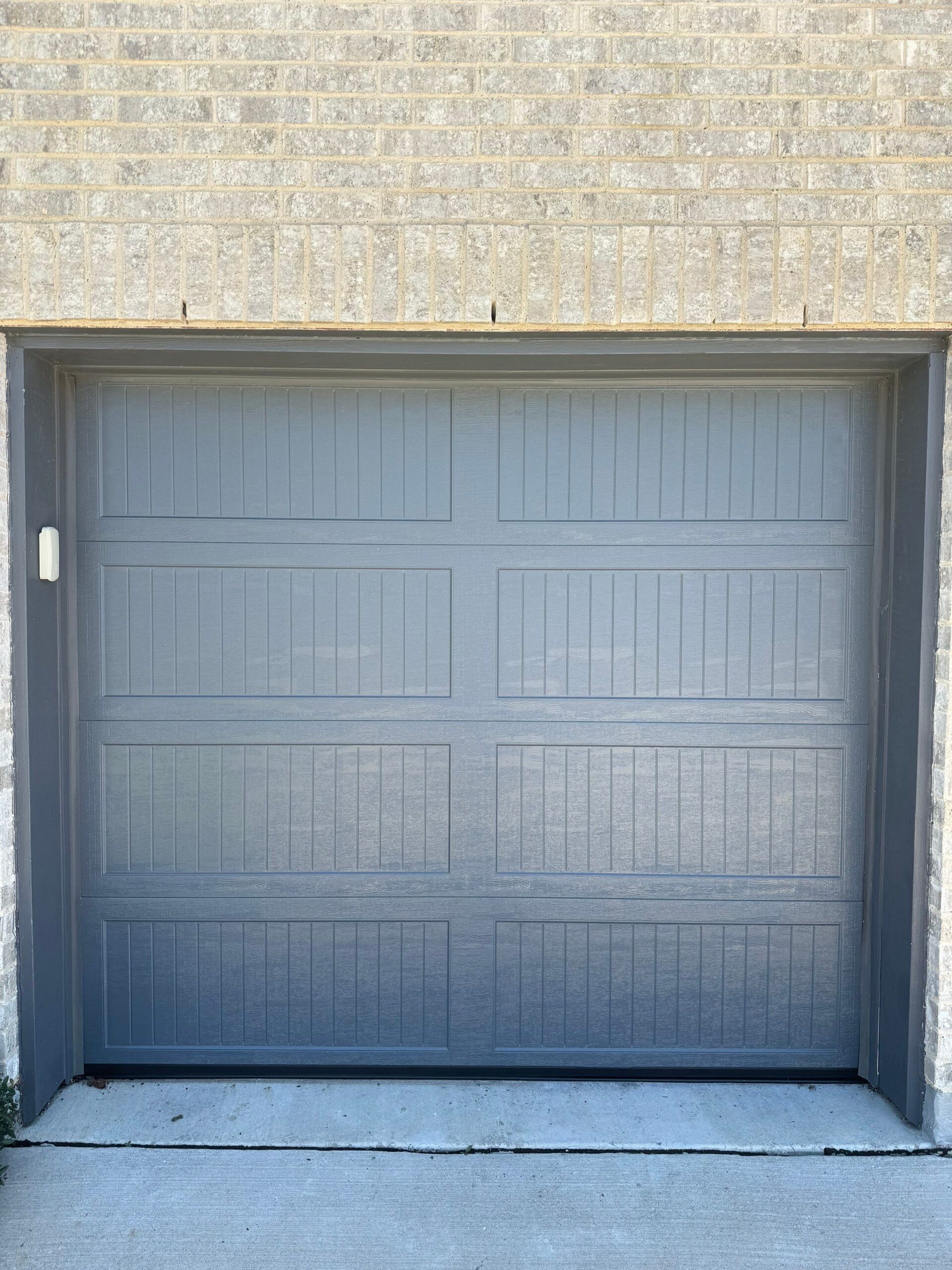 Single door, residential gray garage door