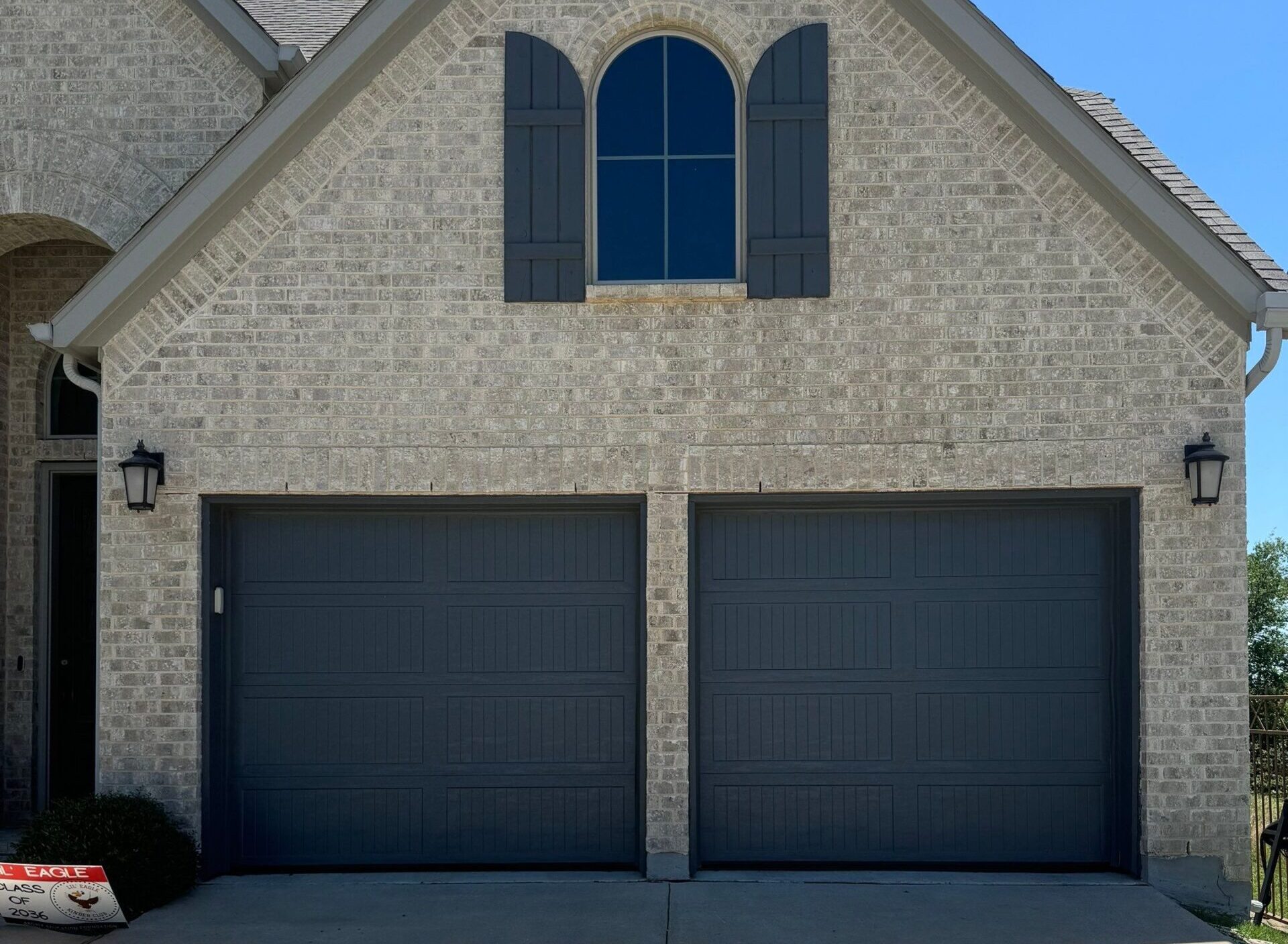 Residential two single garage doors gray.