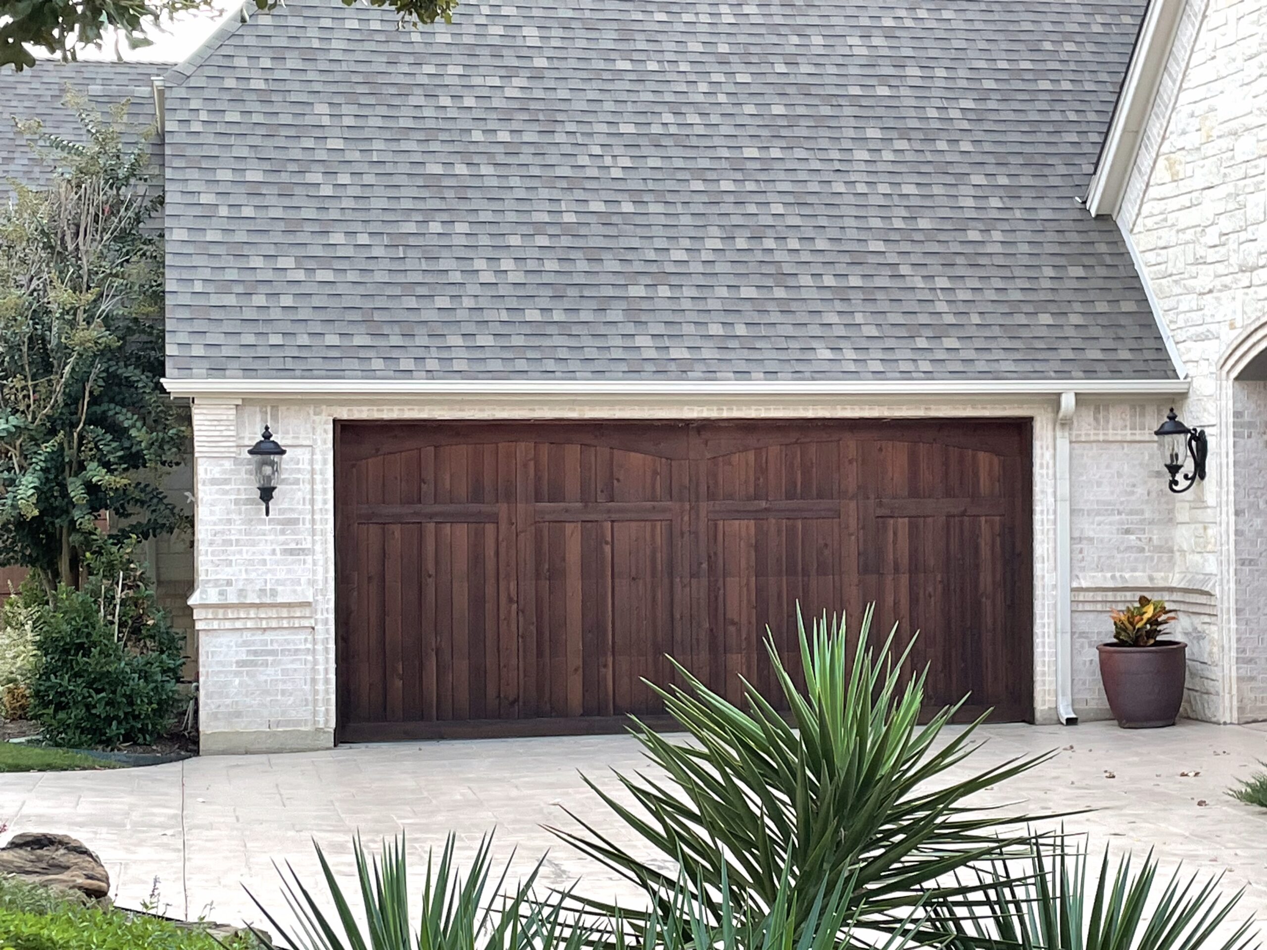 Brown wooden two-car residential garage door