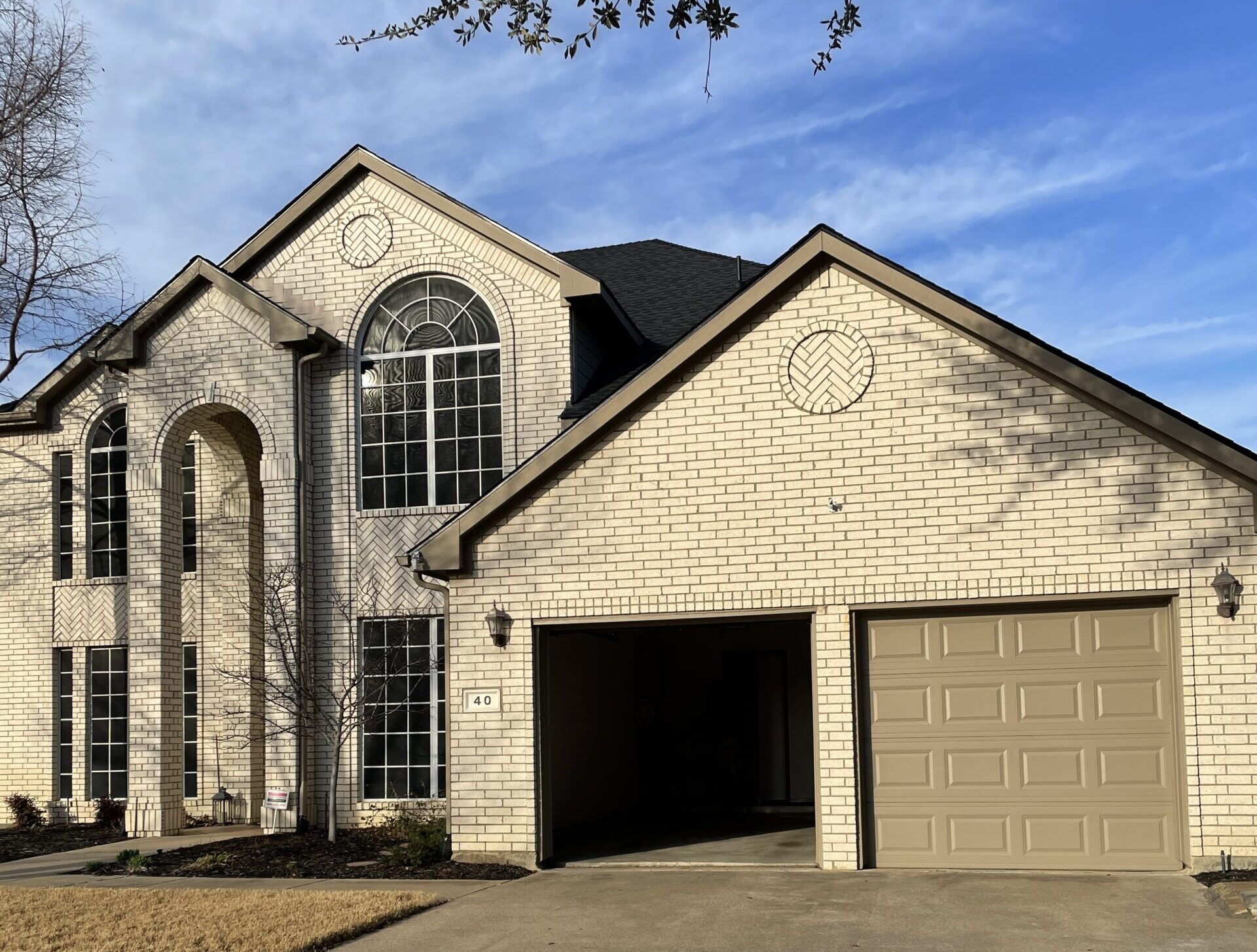 2 door residential garage door, one door open.