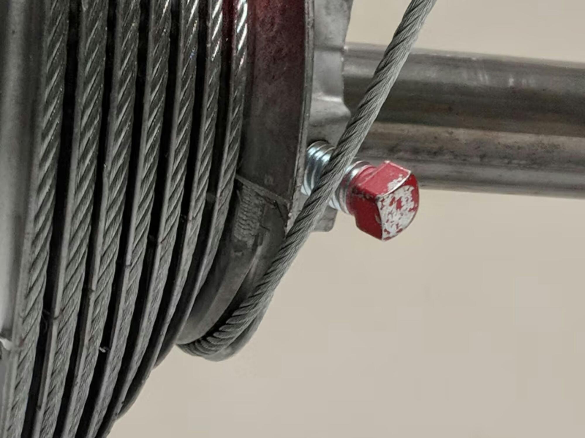 Close up of a garage door cable