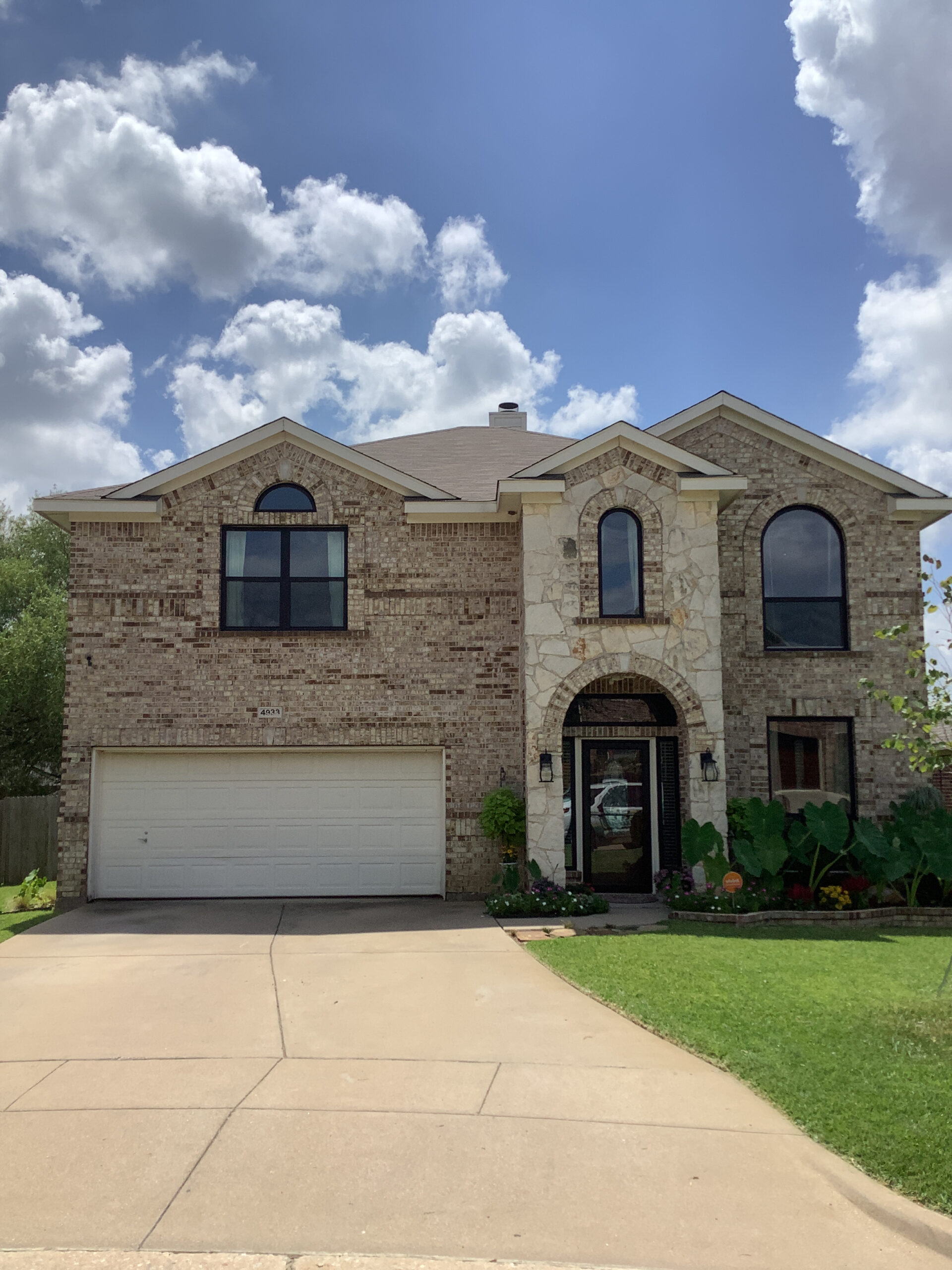 Residential home with white two door garage door