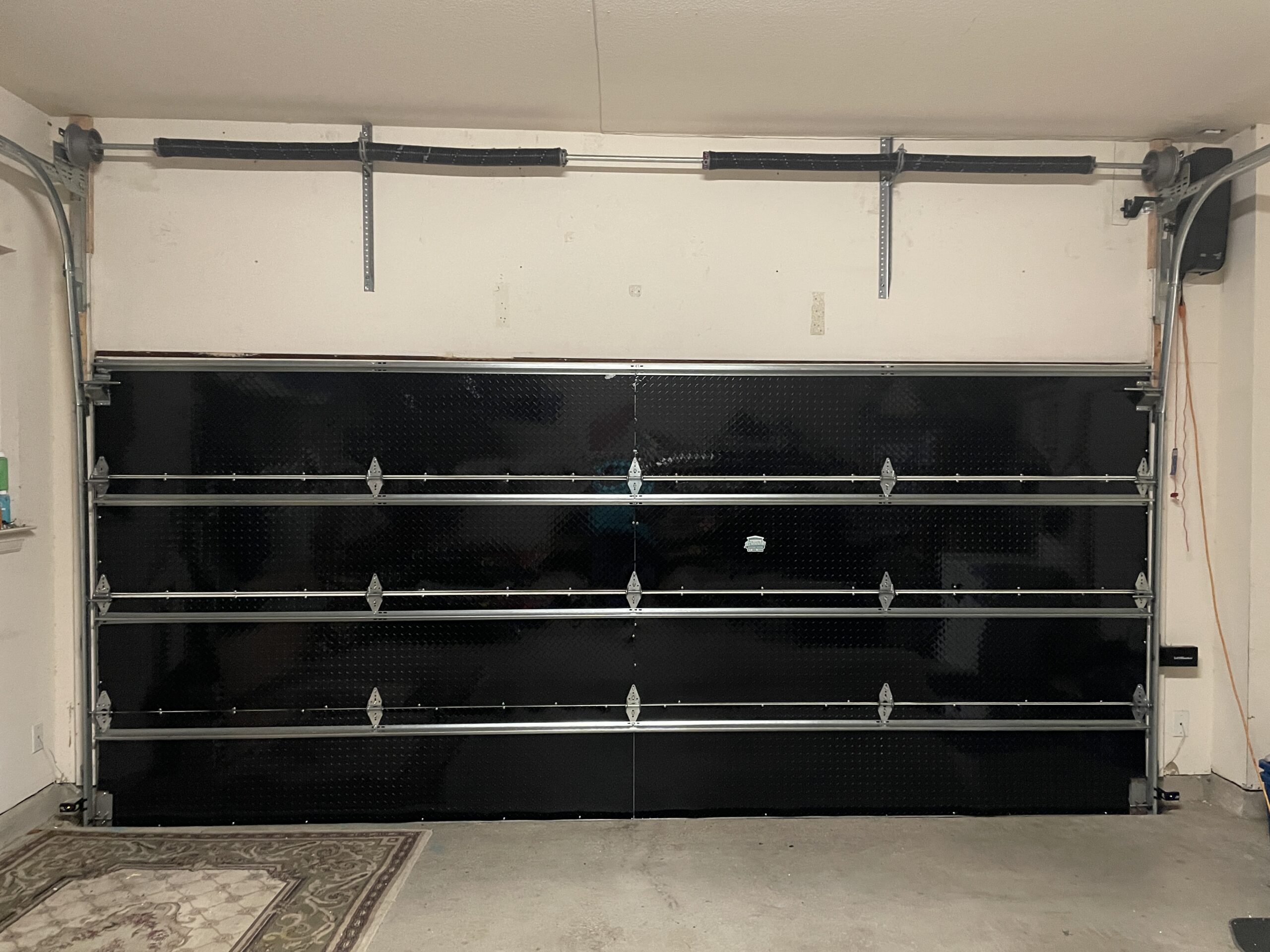 Interior insulated garage door. Wall mounted garage door opener.