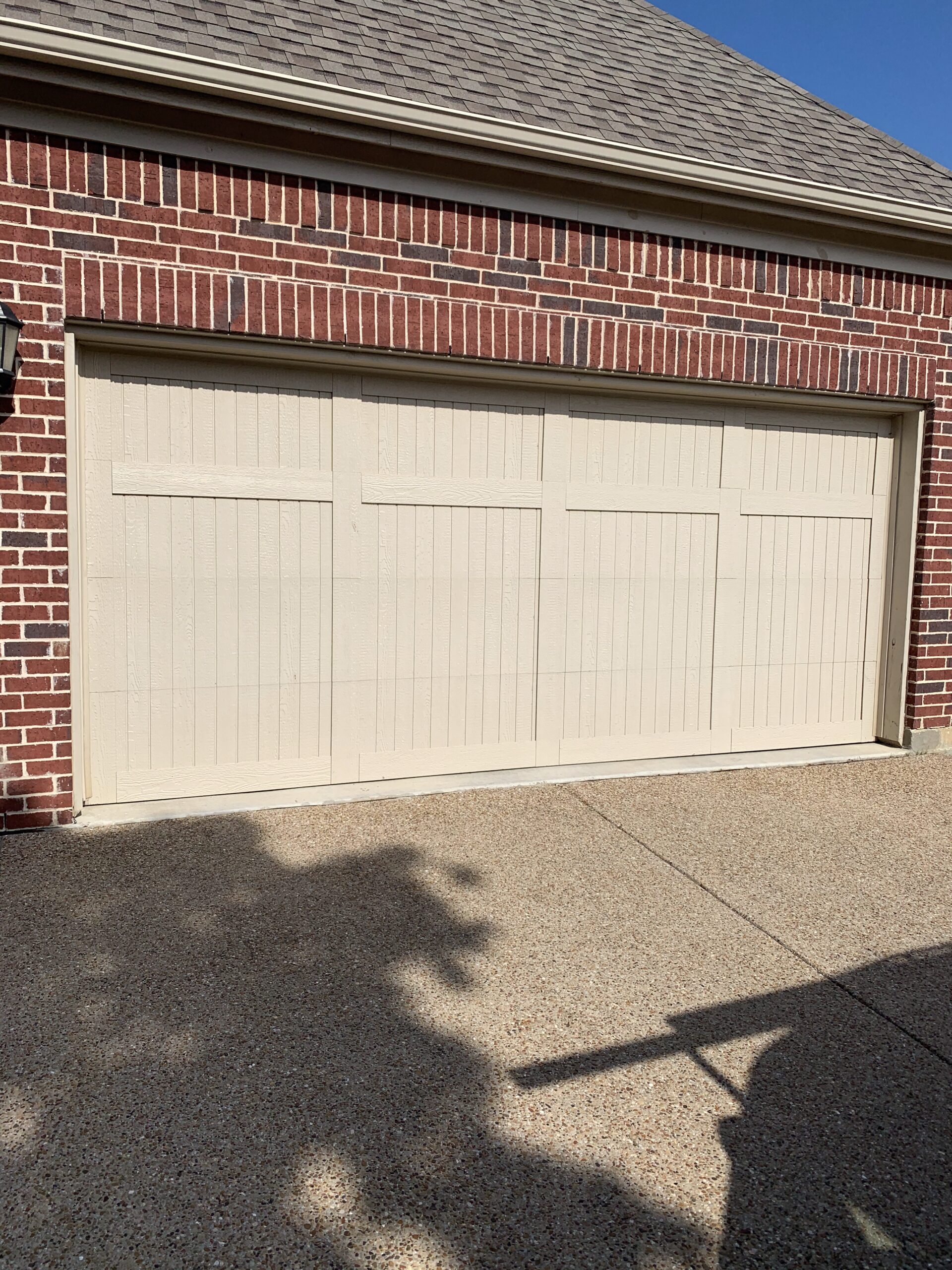 White carriage style residential garage door.