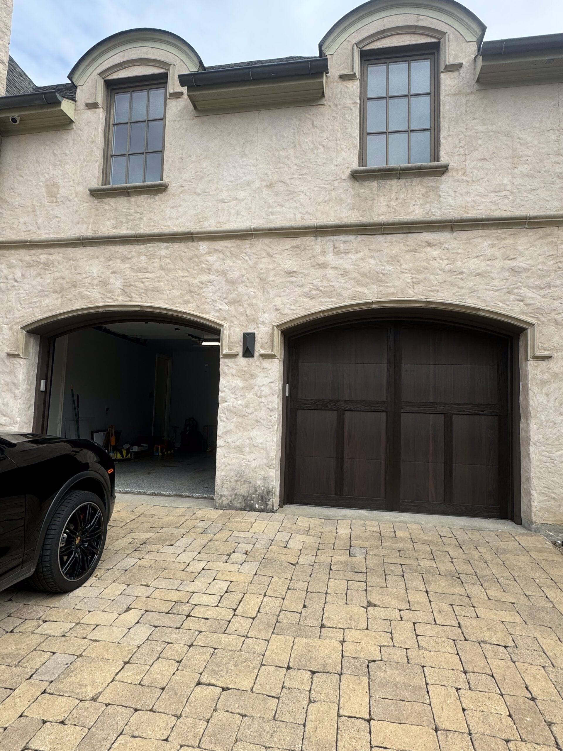 Two door, two car residential luxury wood garage doors.