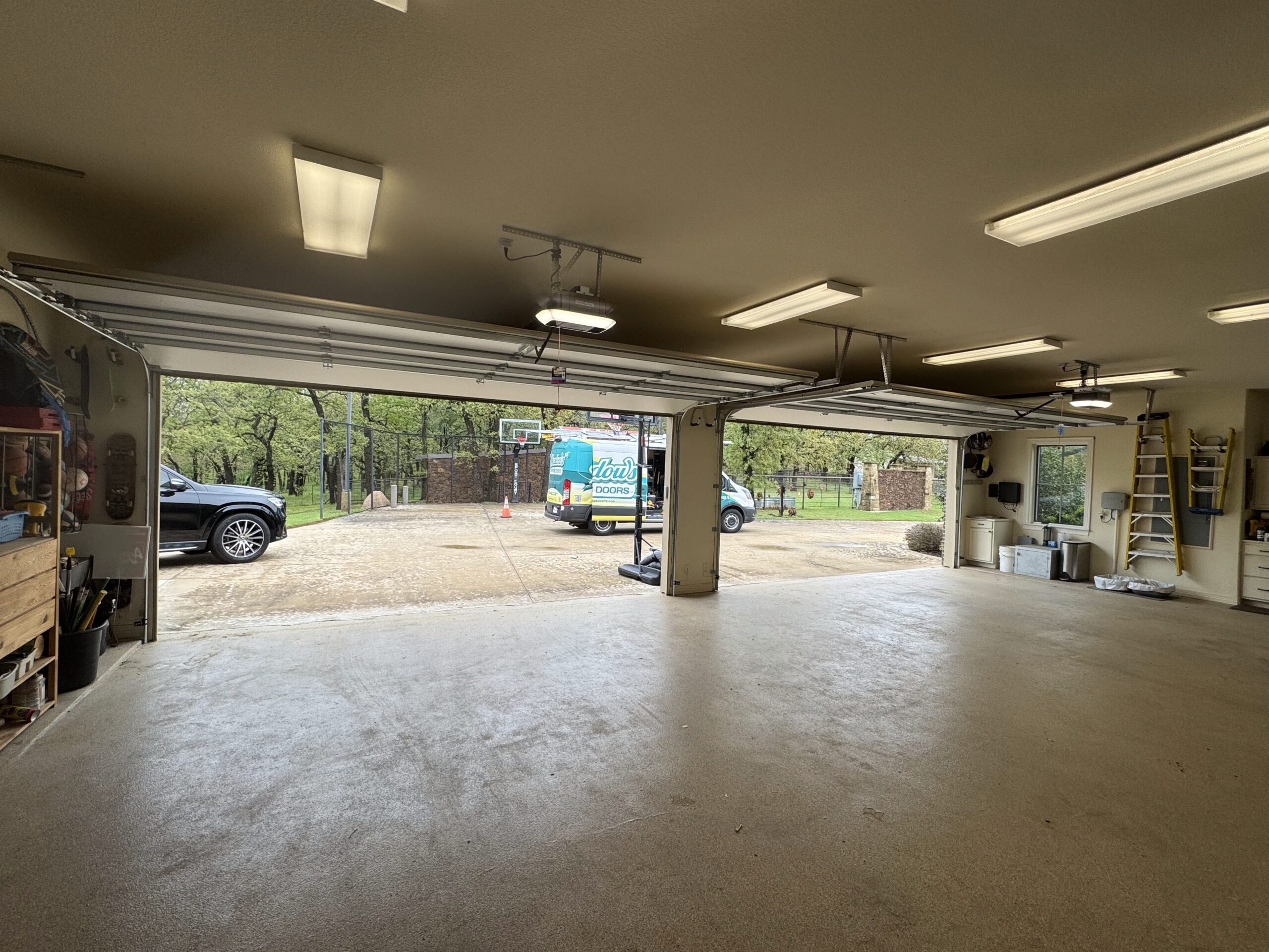 Two door, four car open garage door interior.