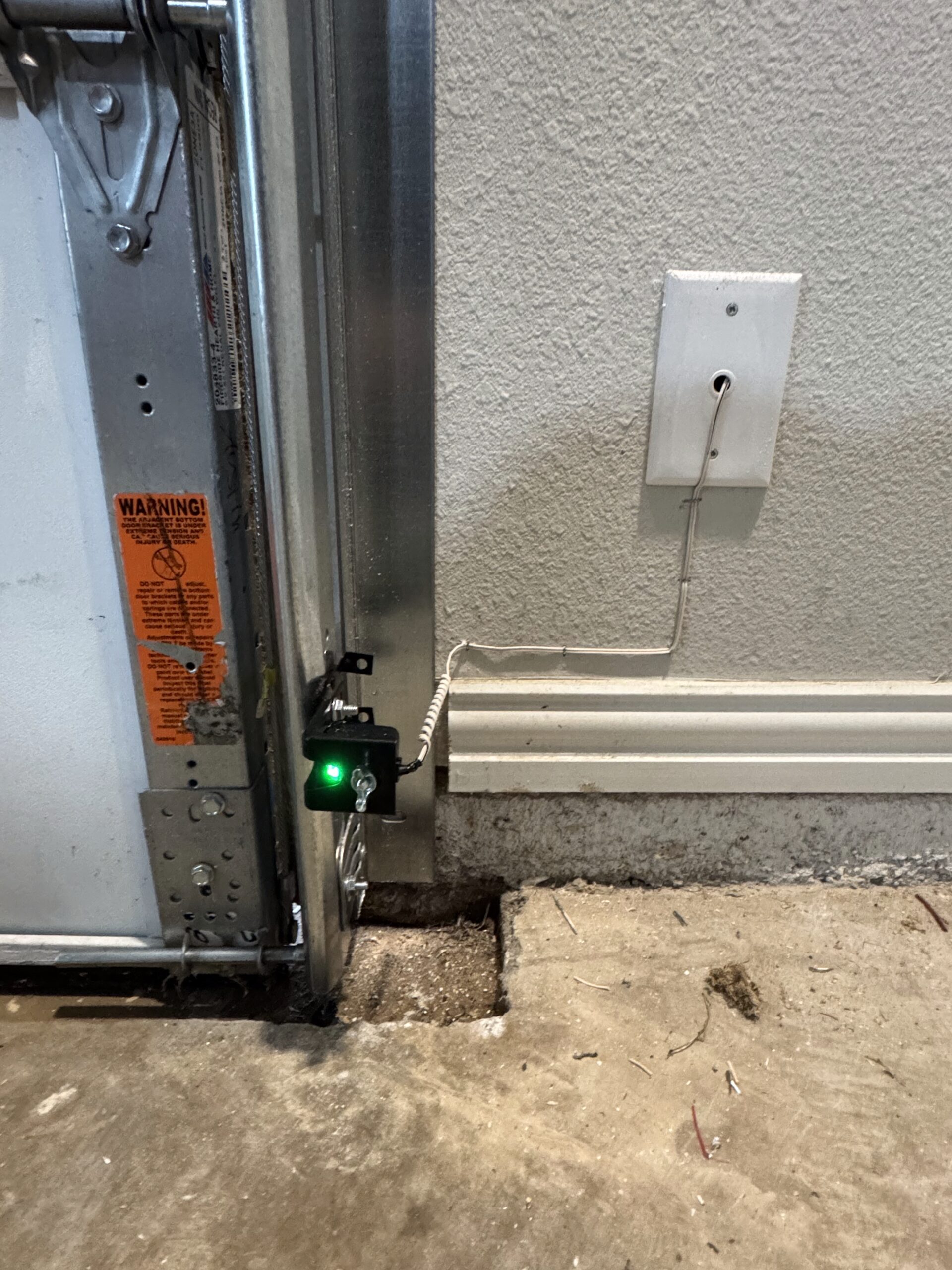 Updated garage door sensor with green light indicator.